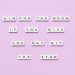 Inspirational message using Scrabble tiles on a pastel background.